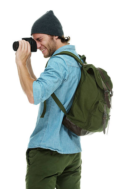 istock Smiling photographer in action with camera 542549456