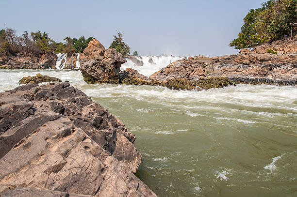 istock Raging water flowing down waterfall during rainy season 542552432