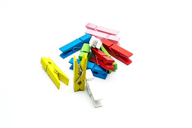 istock Colorful wooden clothespins isolated on white background 542553594