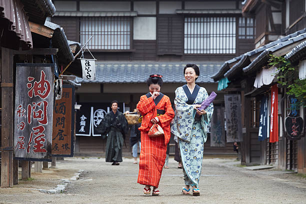 istock smiling chatting young Japanese women 542554370