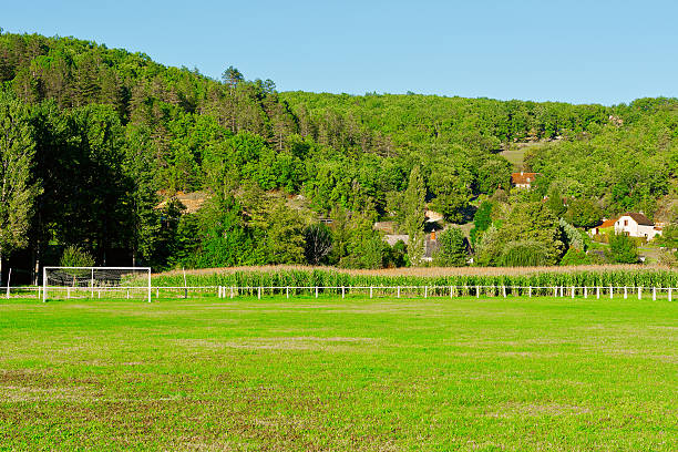 Football Field on the Background of Village in France