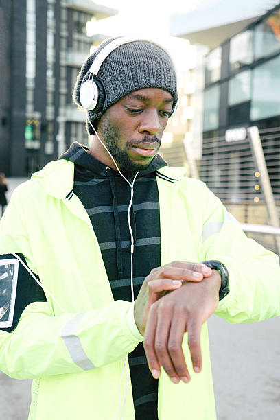 istock Sport Man Looking At His Smart Watch 542555428