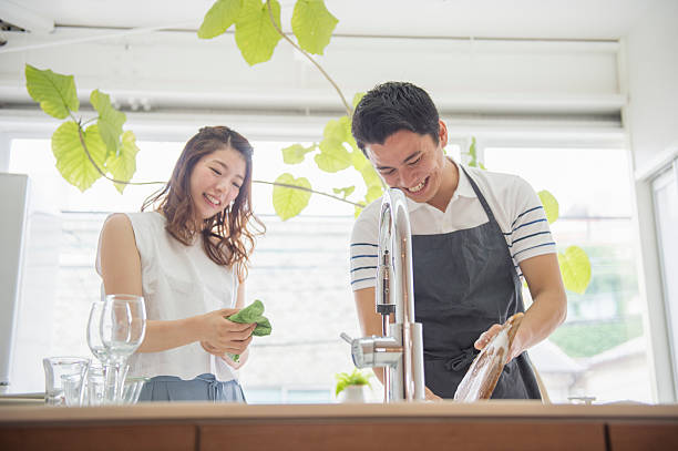 istock Young couple washing dishes together. 542555666
