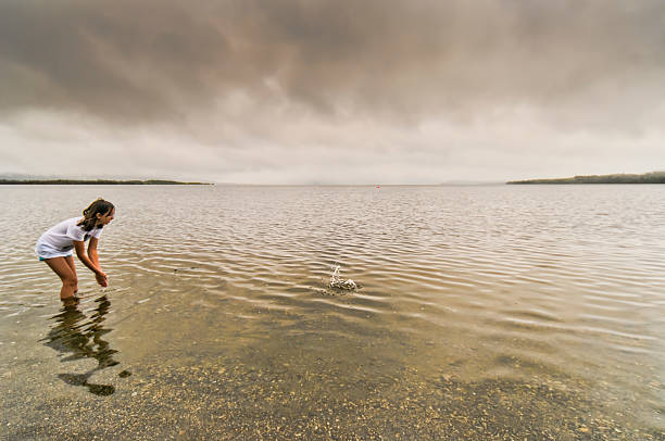 istock Girl in water 542556356