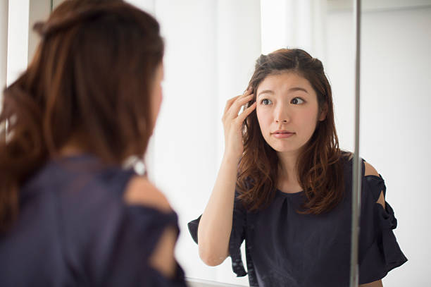 istock Women stare in the mirror 542556724