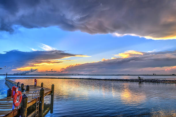 Sunset on the Chesapeake Bay in Maryland with the Key bridge and Baltimore on the horizon.