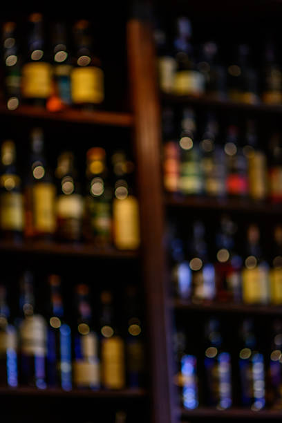 istock Blurred of wine bottles. Vertical blurred image of bottles 542560656