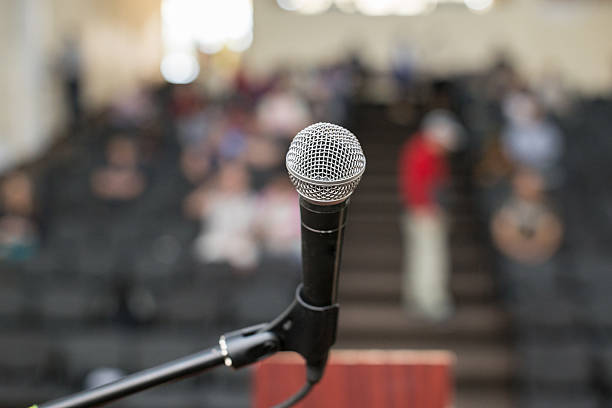 istock microphone against the background of convention center 542561776