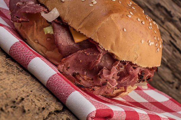 istock roast beef burger on wooden table 542563018