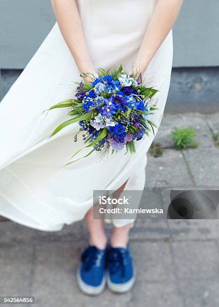Young Hip Bride Holding Bouquet Of Wildflowers Matching Her Sneakers Stock Photo - Download Image Now