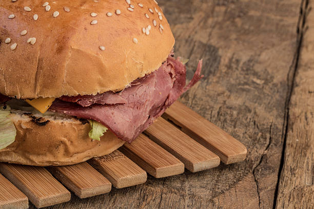 istock roast beef burger on wooden table 542565928