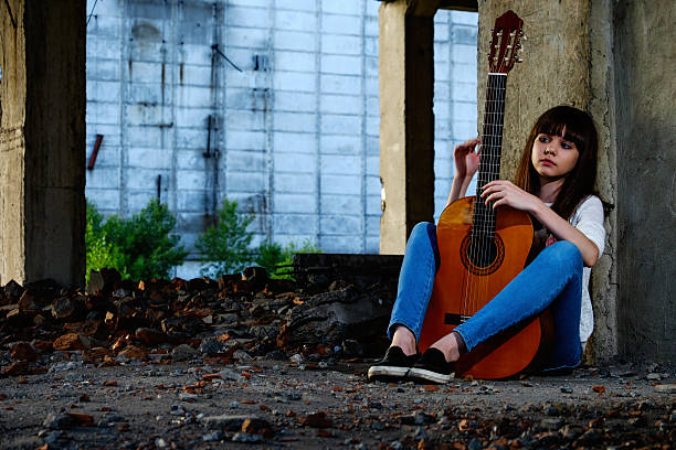 istock Girl with guitar 542566020