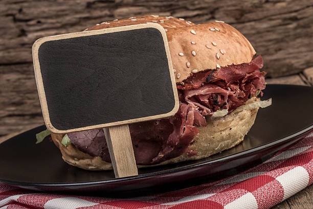 istock roast beef burger on wooden table 542566066