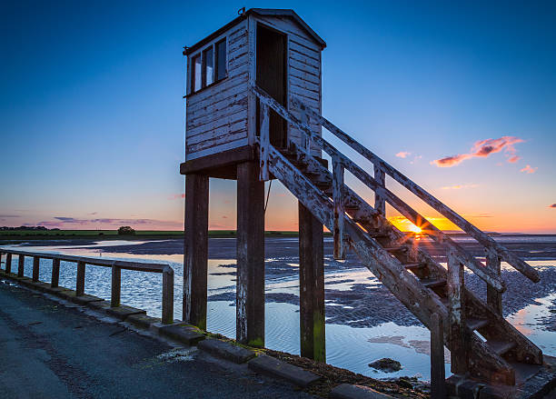 istock Summer Solstice sunset on Holy Island, England 542566514