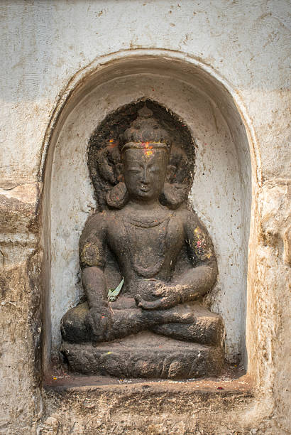 istock Little buddha statue in nich in temple Nepal 542568524