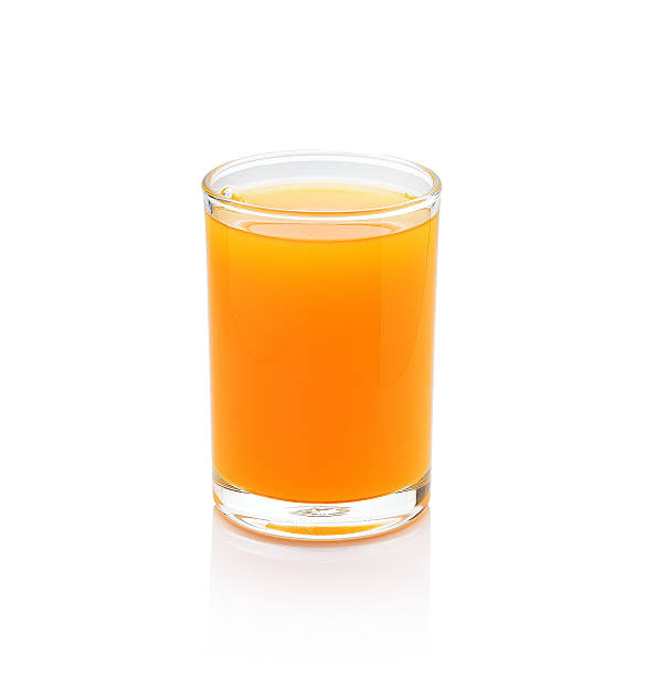 istock glass of orange juice on white background 542569336