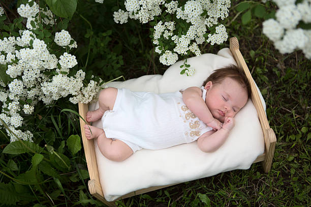 istock newborn baby outside in the grass 542572338