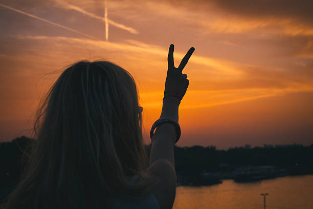 istock Two fingers - conceptual symbol for peace. 542574802