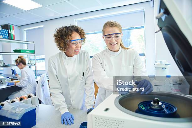 University Student Loading A Centrifuge Stock Photo - Download Image Now - Laboratory, Centrifuge, Chemistry