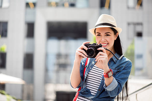 istock Delighted smiling woman taking photos 542577166
