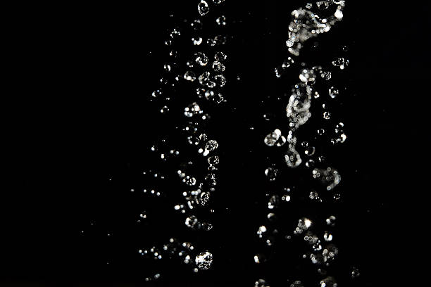 istock Blur Water drops fly in the air with defocused lights 542577404