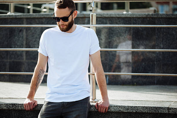 hipster wearing white blank t-shirt with space for your logo - europese etniciteit stockfoto's en -beelden