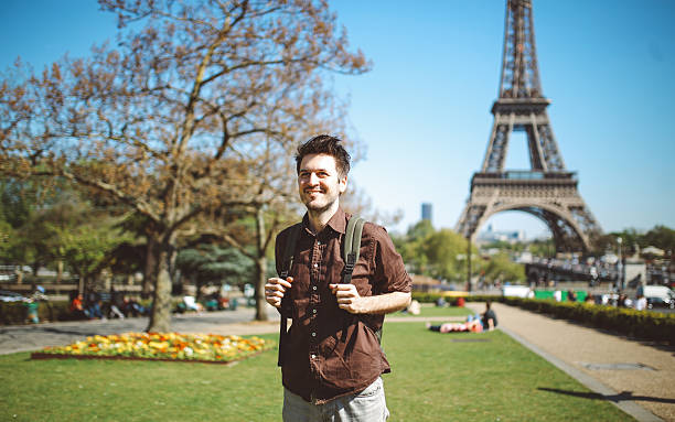 istock Young tourist man relaxing in Paris 542578088