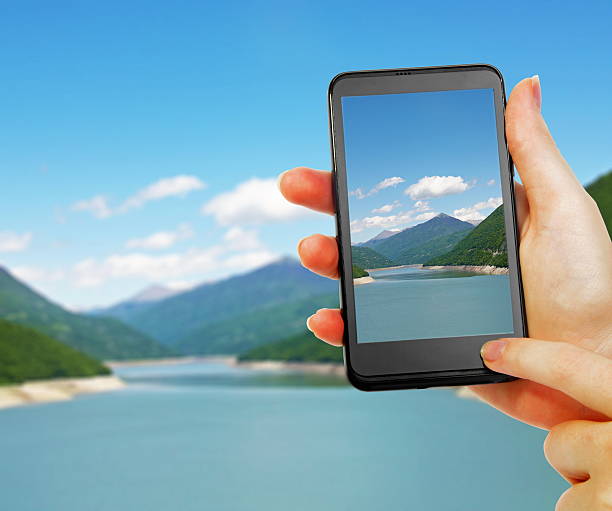 istock taking photo of the mountain landscape 542578562