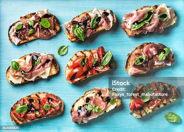 Brushetta Snacks For Wine Variety Of Small Sandwiches On Turquoise Stock Photo - Download Image Now