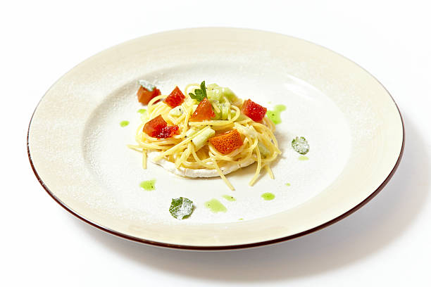 Sweat pasta nests with fruits isolated on white