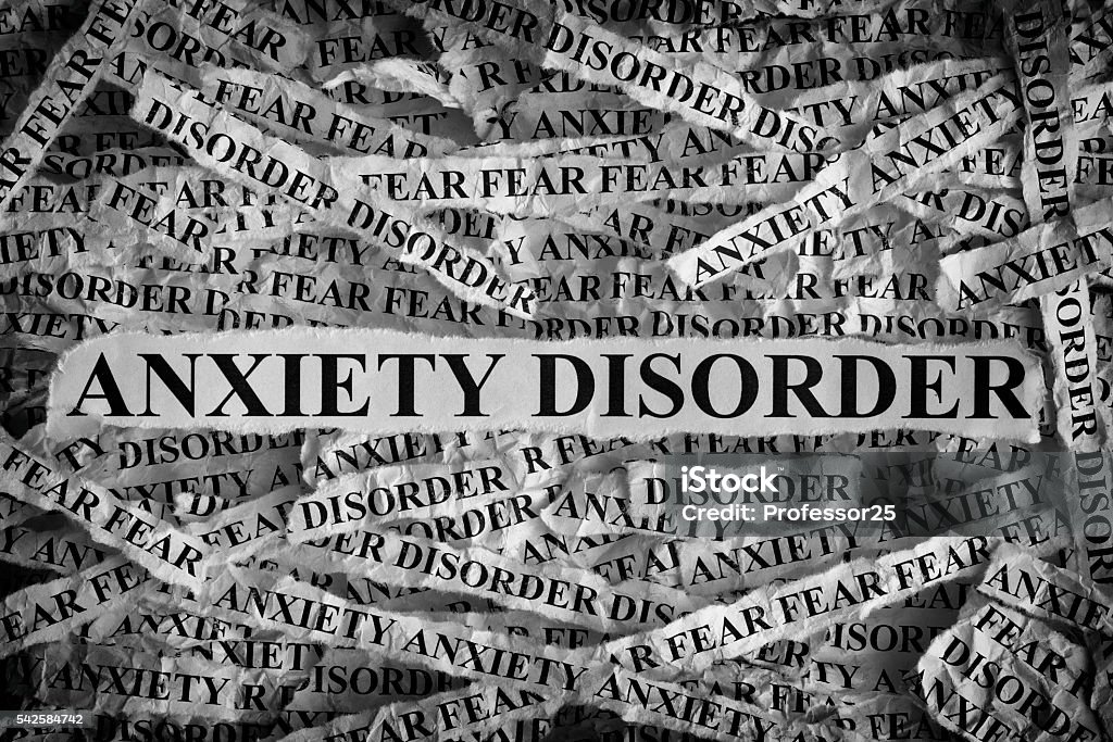 Anxiety Disorder Anxiety Disorder. Torn pieces of paper with the words Anxiety Disorder. Concept Image. Black and White. Closeup. Anxiety Stock Photo