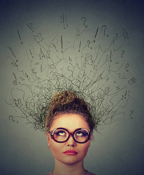 istock woman wondering brain melting into lines question marks 542586620