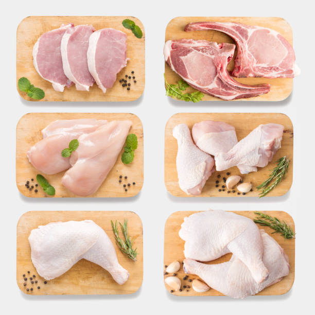 Mockup raw chicken and pork on cutting board set. isolated Mockup raw chicken and pork on cutting board set on  isolated on white background. Copy space for text and logo. Clipping Path included isolated on white background. chicken leg stock pictures, royalty-free photos & images