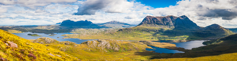 Dramatic mountain peak panorama of Cul Mor, Suilven and Canisp, the rugged wilderness landscape of Inverpolly and Assynt deep in the Highlands of Scotland. ProPhoto RGB profile for maximum color fidelity and gamut.
