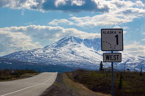 The Alaska road sign number one shows direction to the west on scenic route of Glenn highway.