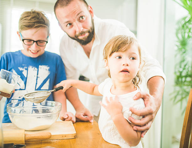 istock Family cooking in the kitchen 542592098