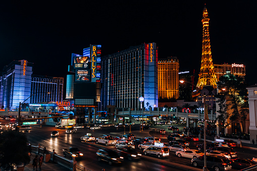 Las Vegas, Nevada, United States of America  April 8, 2019: Las Vegas Boulevard aka The Strip at night lit by neon signs and large screens with ads