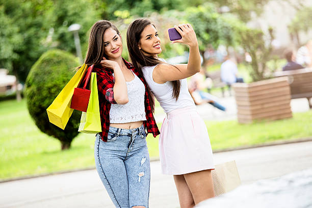 istock Girls taking a selfie after shopping 542681306