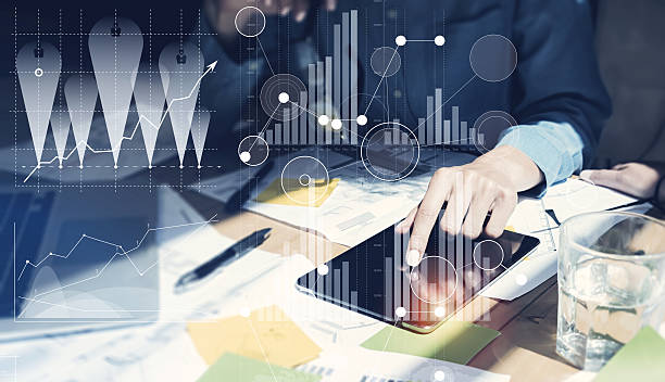 istock Woman Touching Screen Electronic Tablet Hand.Project Managers Researching Process 542681416