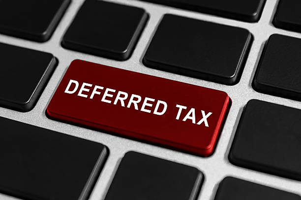 deferred tax button on keyboard stock photo