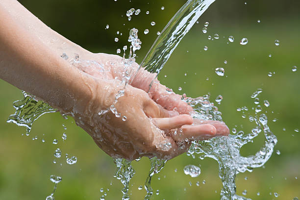 istock woman washing her hands, closeup 542688254