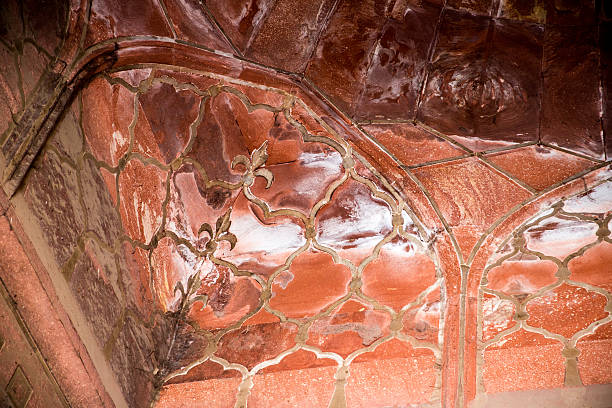 As a background, a glimpse at the beautiful architecture of Qutab Minar. Known worldwide, its complex was built in Indo-Islamic architecture style. Red sandstone was used for the structure seen in the image.