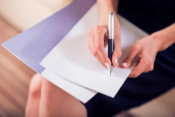 istock Close up of hands wring on paper 542693792