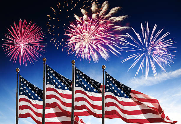 istock american flag waving for a national holiday with fireworks 542694232
