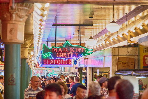 Seattle, United States - June 6, 2016:  Crowds of shoppers at the Pike Place Market on the waterfront of Seattle, Washington.