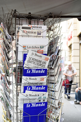 Strasbourg, France - June 25, 2016: Le Monde french magazine with shocking headline titles that UK leaves EU at press kiosk about the Brexit referendum in United Kingdom requesting to quit the European Union