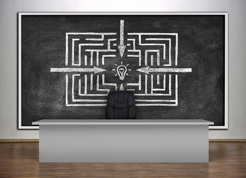 presentation room in a university and chalk board with drawing success labyrinth