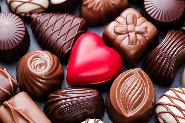 Assortment of chocolate candies, white, dark, milk chocolate Sweets background stock photo