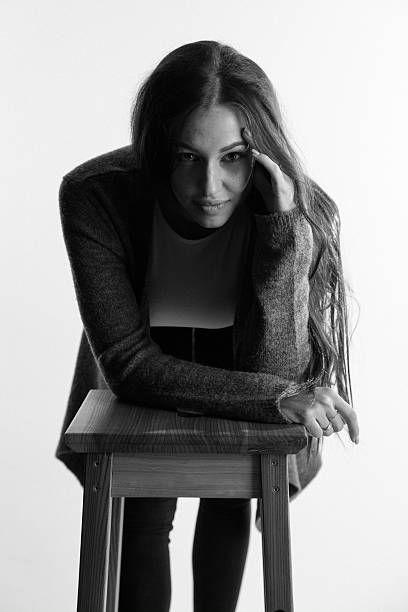 istock Beautiful attractive girl thinks. Black and white. Toned image 542698128