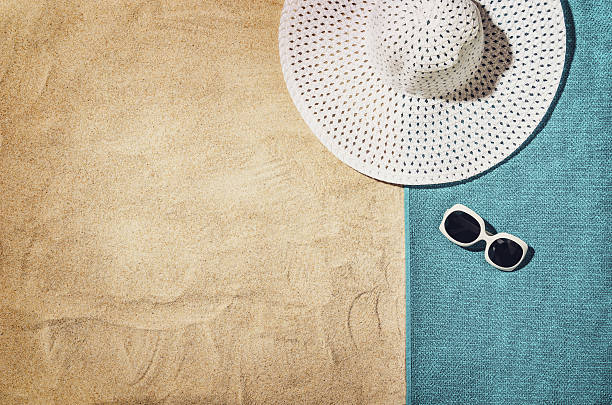 istock Top view of sandy beach with summer accessories 542698802